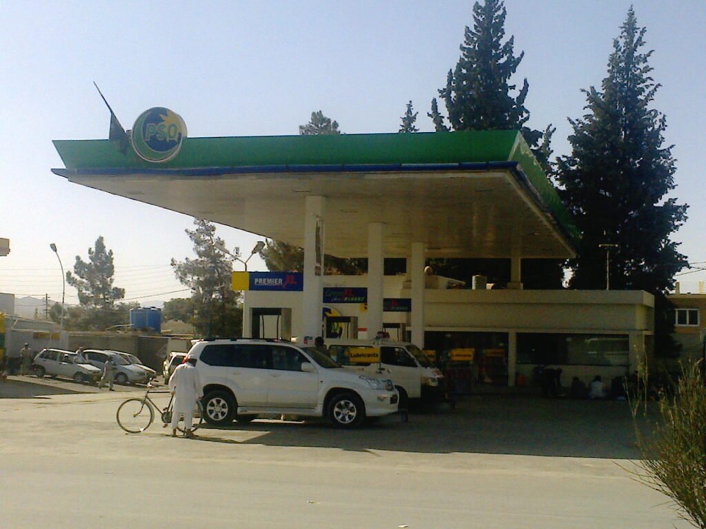 A car being refueled at a petrol station in Pakistan