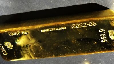 Stacked gold bars in a vault