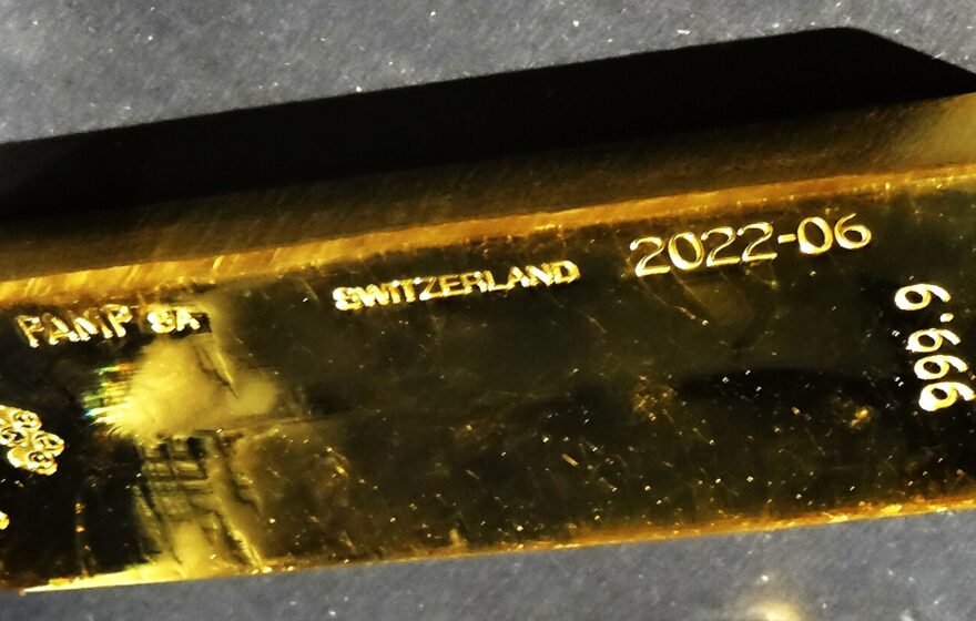 Stacked gold bars in a vault