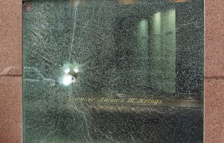 A window damaged in a burglary attempt
