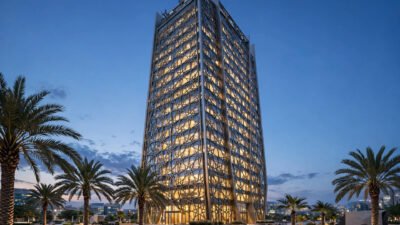 Modern Islamic bank headquarters tower at dusk.