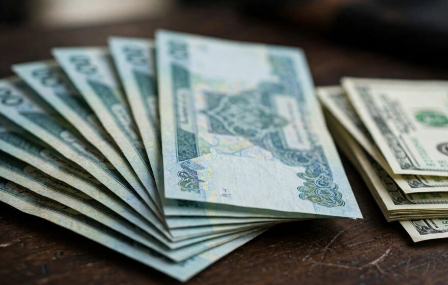Pakistani rupee and US dollar banknotes